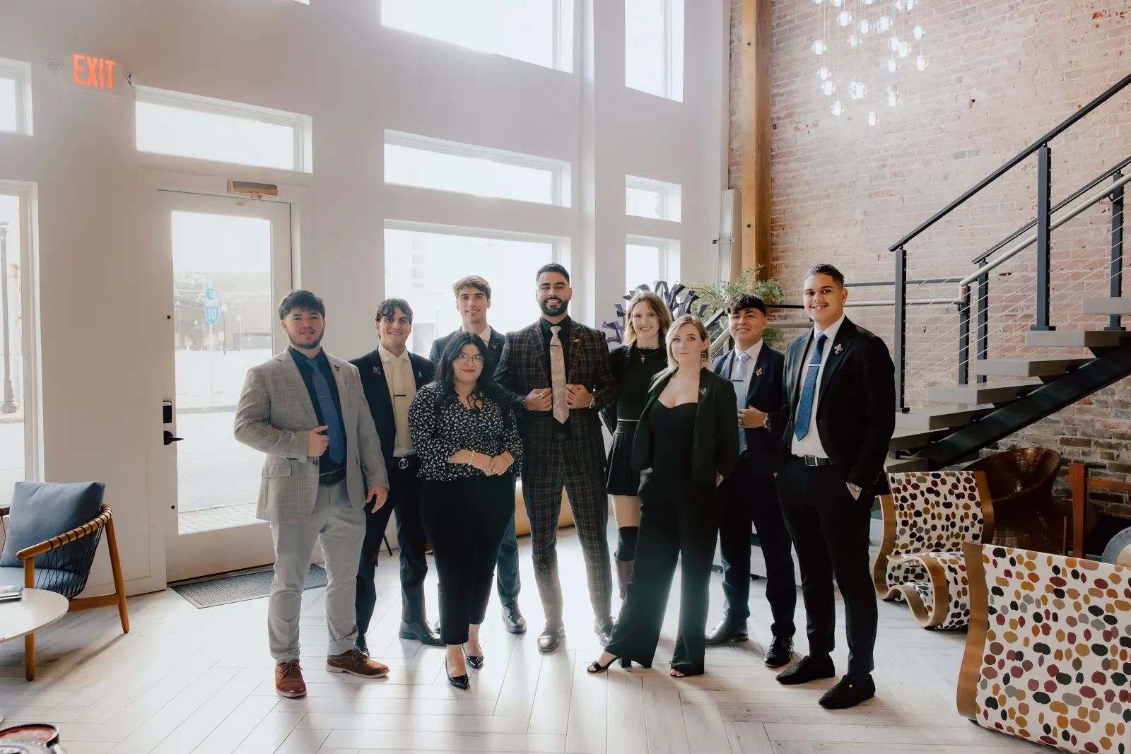The Crescent International team together in the office lobby